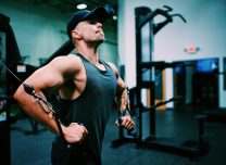 Gordon Cowie working out at the gym doing a cable fly